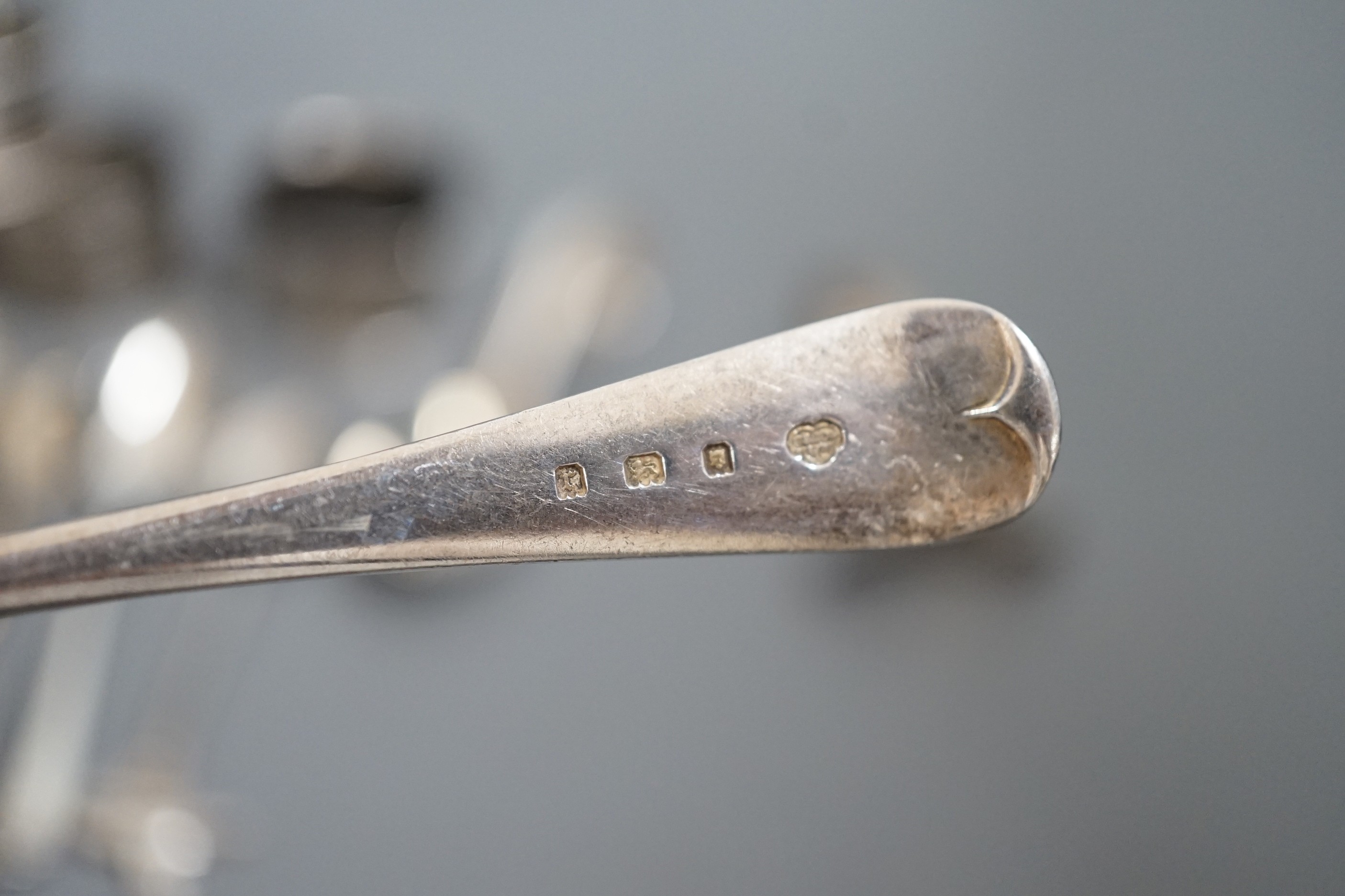 A miscellaneous collection of small silver items to include napkin rings, spoons, etc.